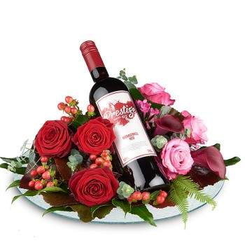 Bloemstuk met rode wijn